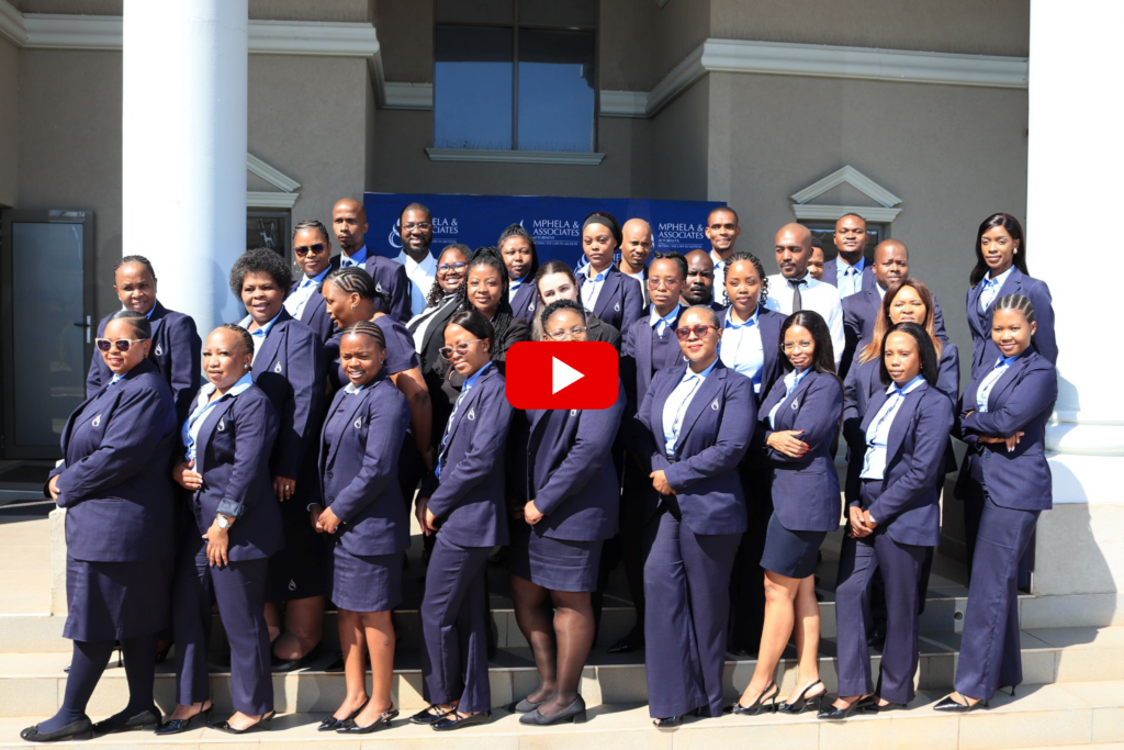 Mphela & Associates staff group at the 40th anniversary, video play button